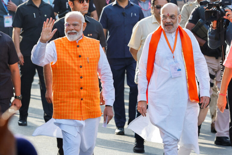 FILE PHOTO: India's Prime Minister Narendra Modi (L) walks alongside Amit Shah, Indian Home Minister