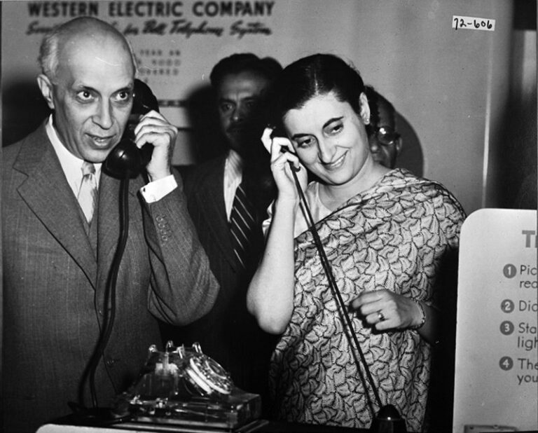 Prime Minister Nehru and Mrs. Indira Gandhi hear a recording of their voices